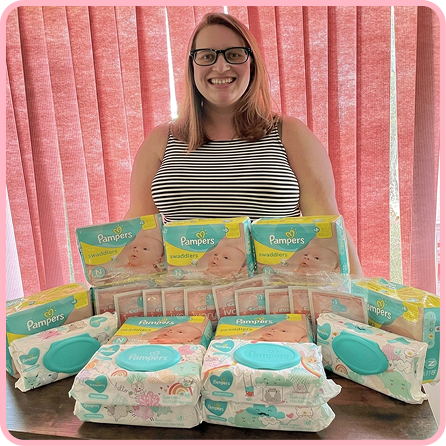 MyBellaBaby giveaway winner holding her prize with her toddler